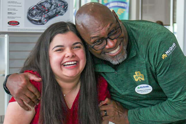 Two McGrath Toyota of Iowa City Staff laughing
