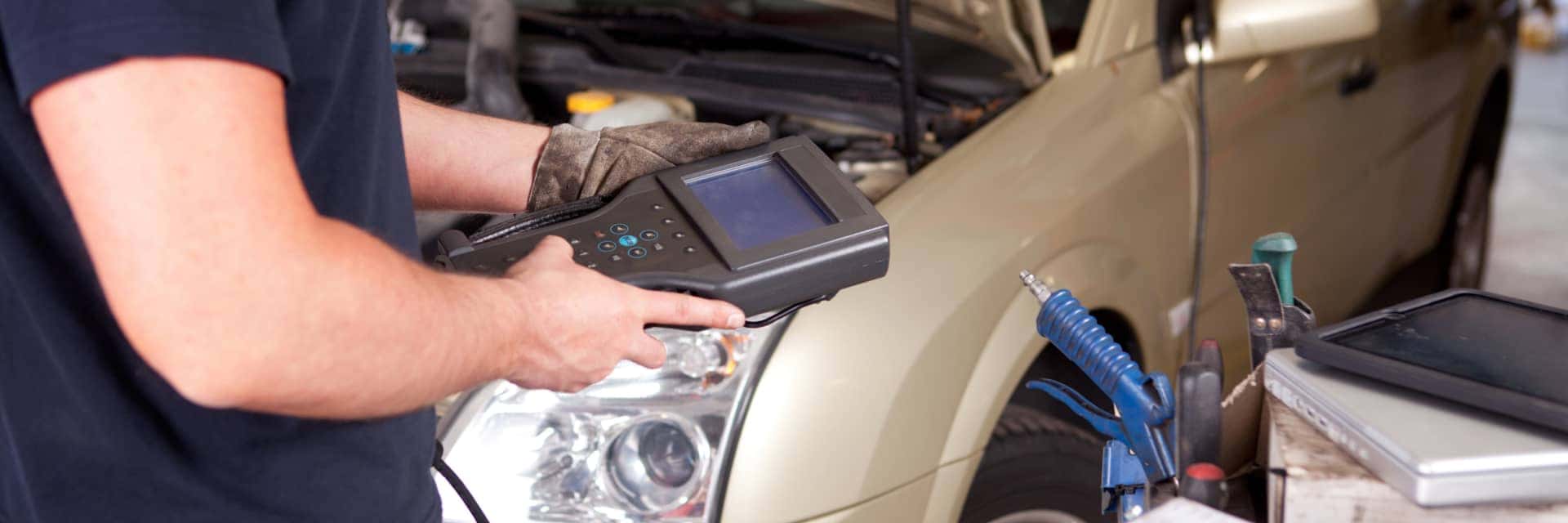 diagnostics-machine-hooked-up-to-vehicle