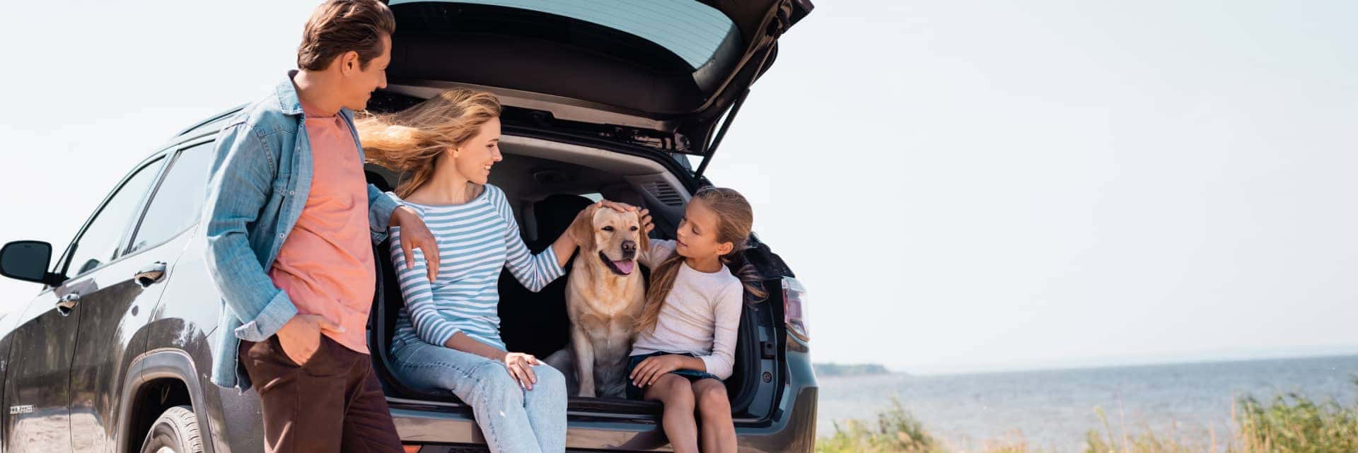 family hanging out in trunk of vehicle