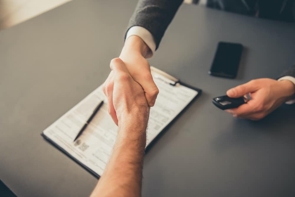 Shaking Hands After Financing or Leasing Car