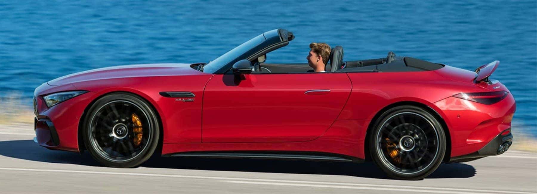 2022amg_sl_roadster-sideview-ocean-road-red