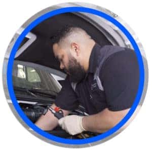 technician checking oil