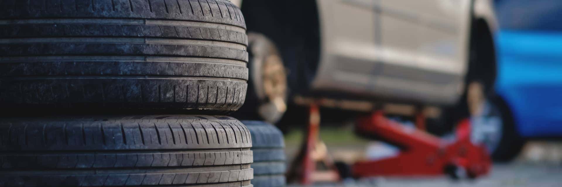 tires-stacked-near-vehicle