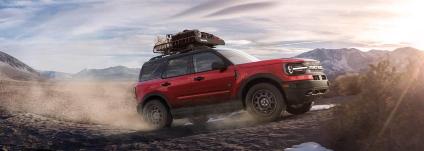 2021 Red Ford Bronco Sport driving on a hill