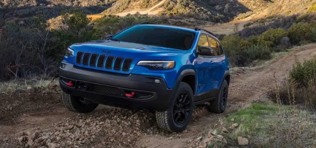Blue Jeep Cherokee Off Road Outside Mountains
