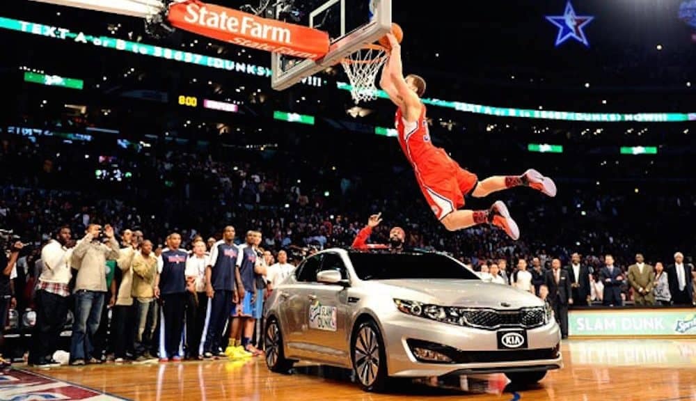 Blake Griffin dunking over a kia