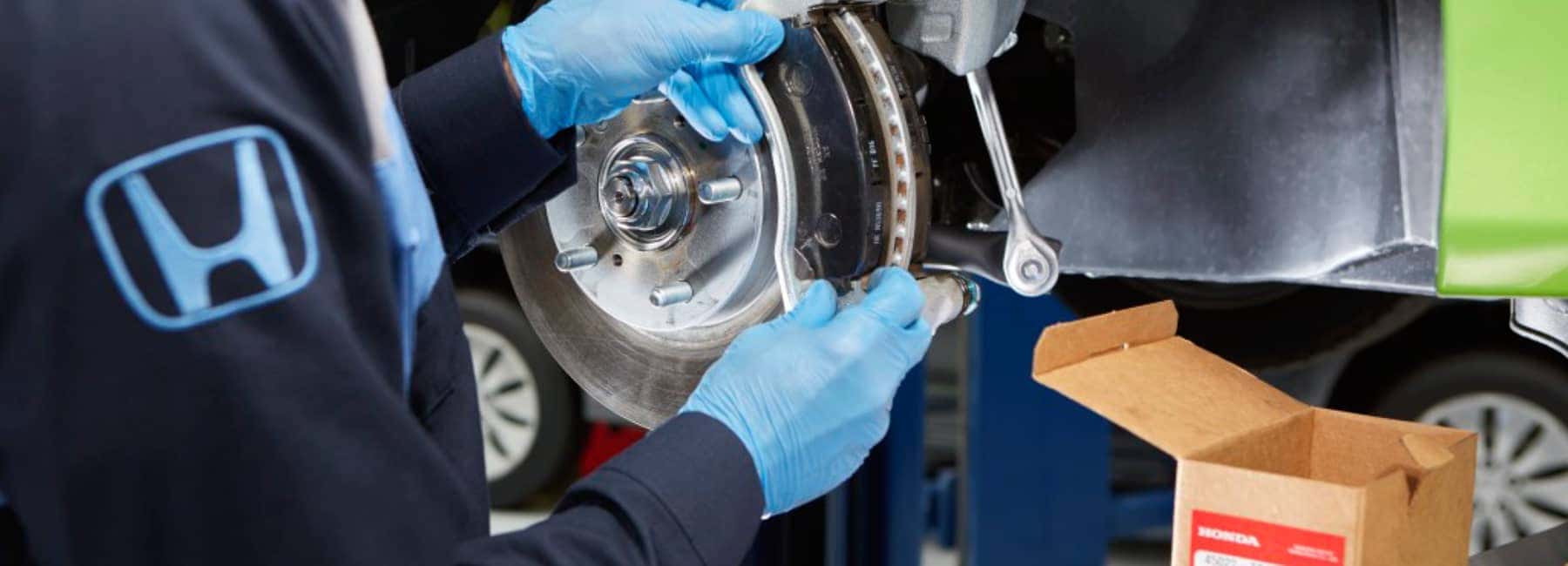 Honda-Technician-Checking-Tire-Pressure-Mobile.jpp