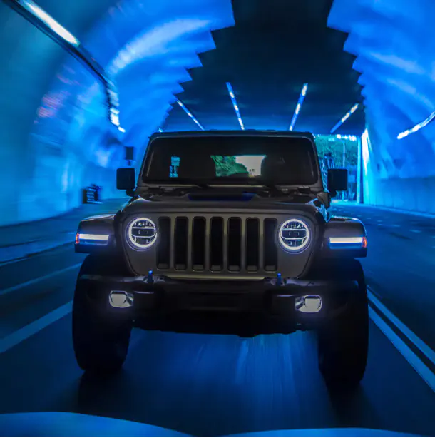 2021 jeep wrangler 4xe front view in a tunnel