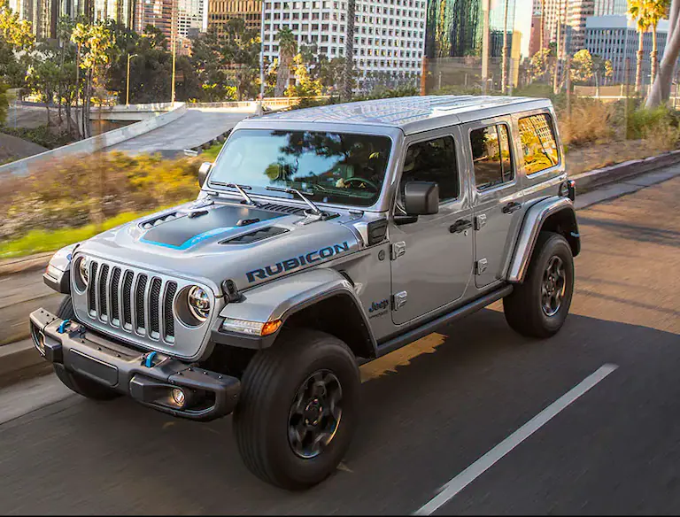 2021 jeep wrangler side view driving on the road