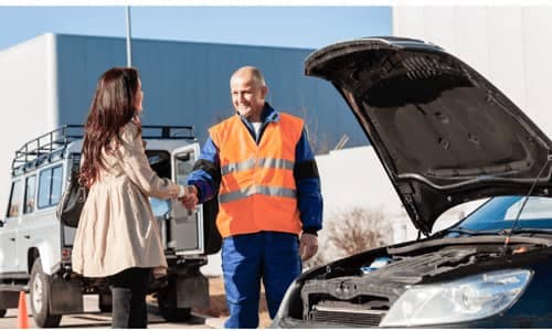 Roadside Assistance progessional shaking hands with a customer