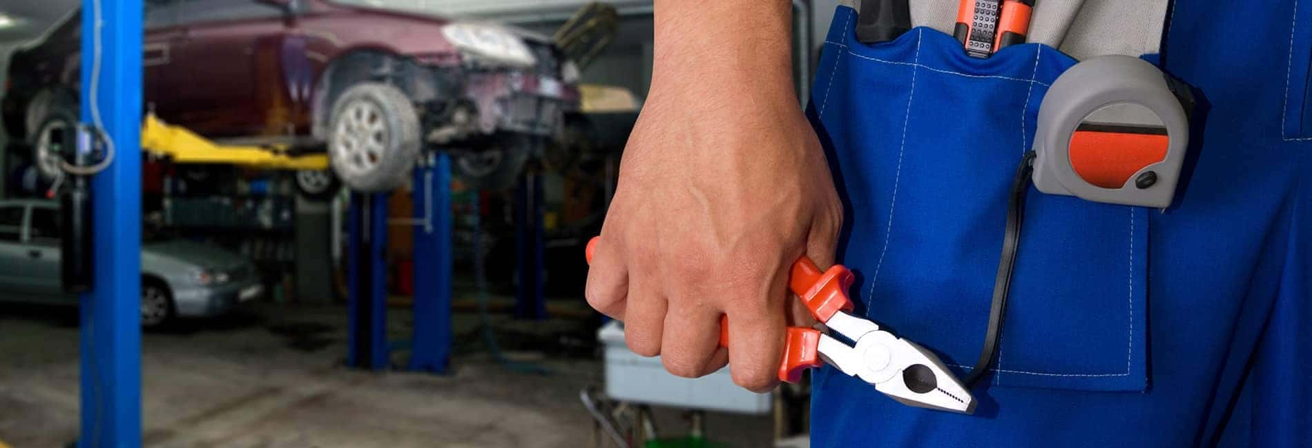 Tool picture of technician's hand holding pliers