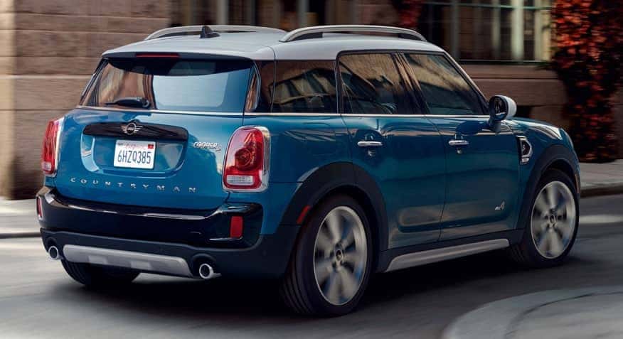 blue MINI turning on road