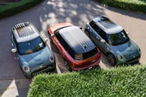 2023-mini-parked-next-to-each-other-in-large-driveway-and-landscaped-shrubs