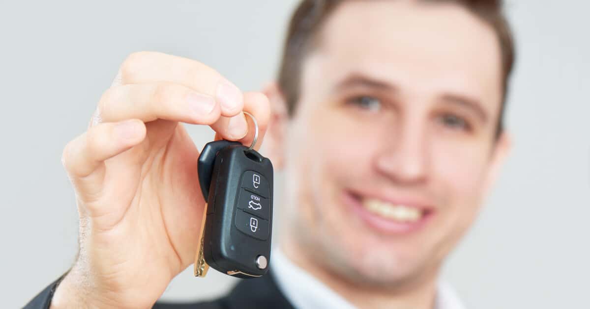 Salesman handing over keys