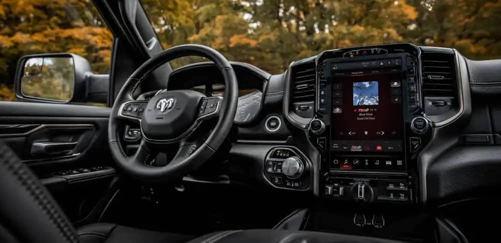 The interior of the 2022 Ram 1500 with the touchscreen displaying a route map.