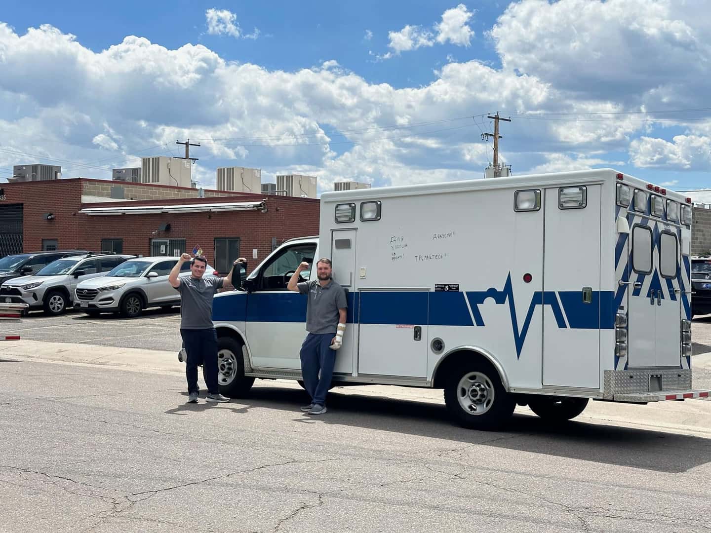 Ambulance with people in front