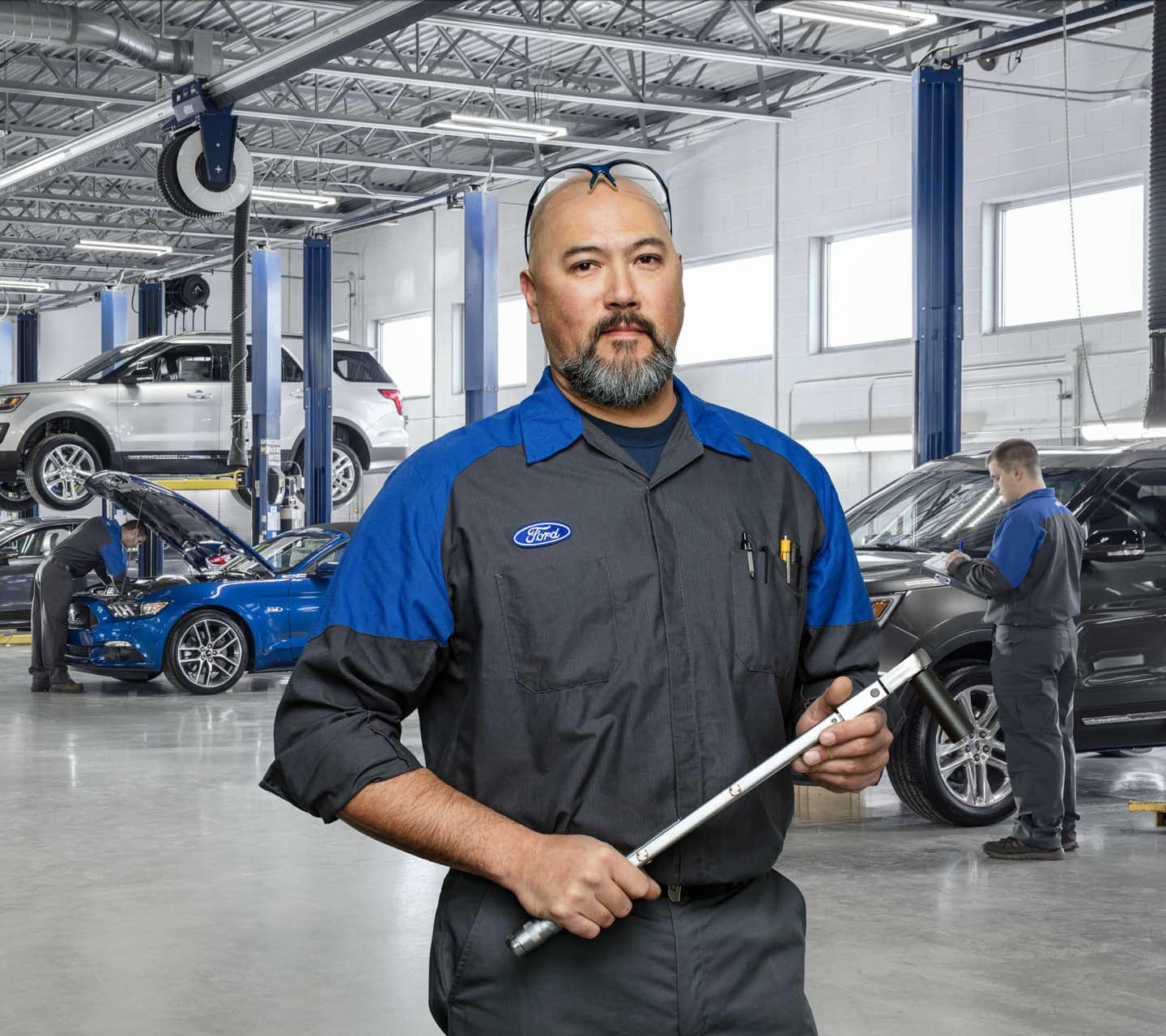 Mechanic holding a tool in the Ford Service Center