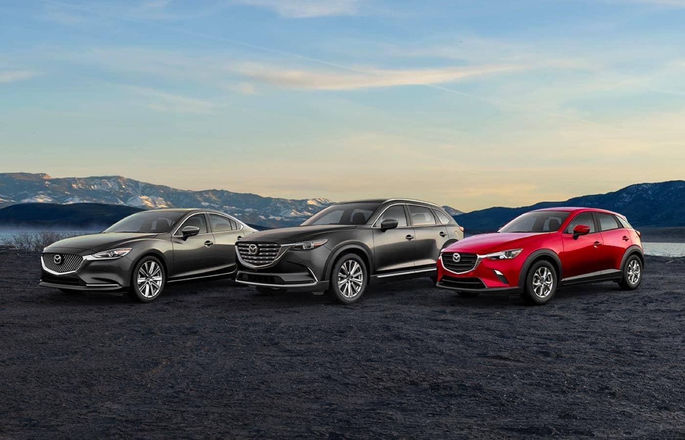 Three Mazda vehicles parked outside