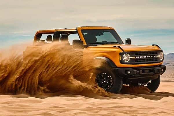 2021 Ford Bronco being driven through the sand_yyth