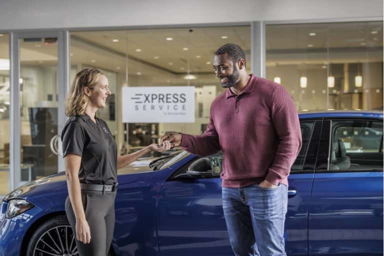 Mercedes-Benz-technician-gives-customer-key-mobile