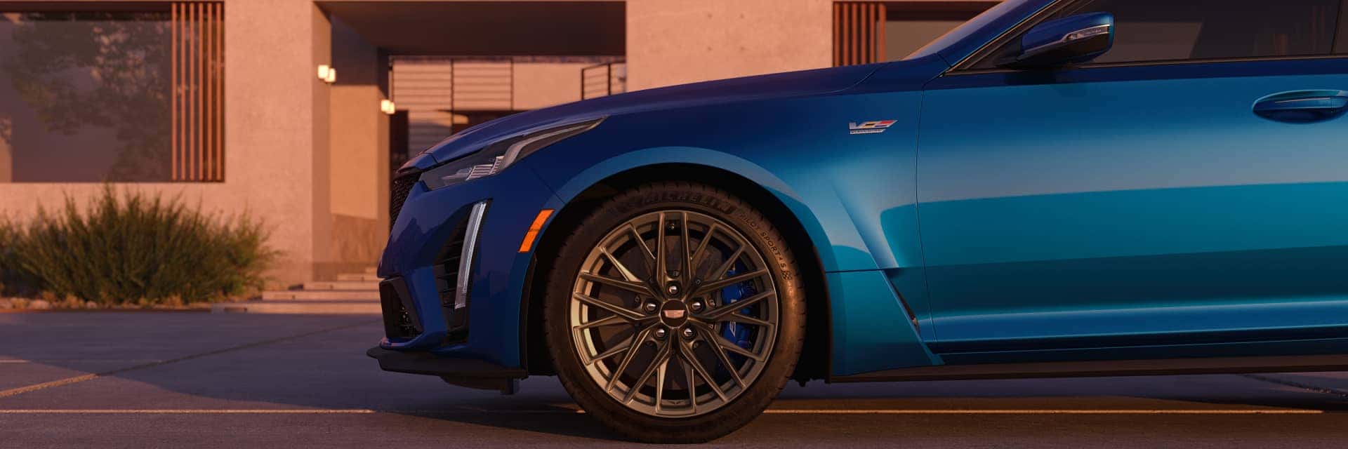 2024 Cadillac CT5 V in front of adobe house at dusk