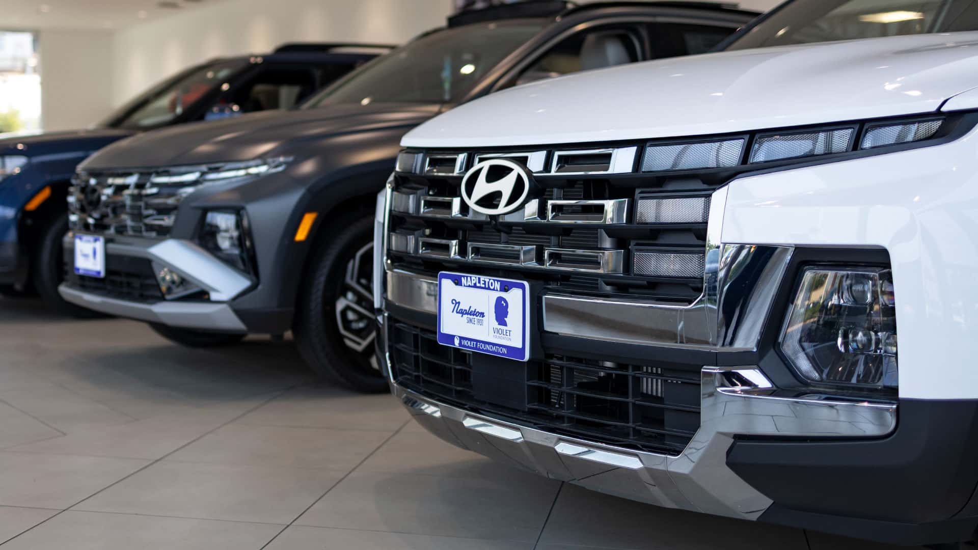 New Hyundai SUVs and sedans on a dealership showroom floor