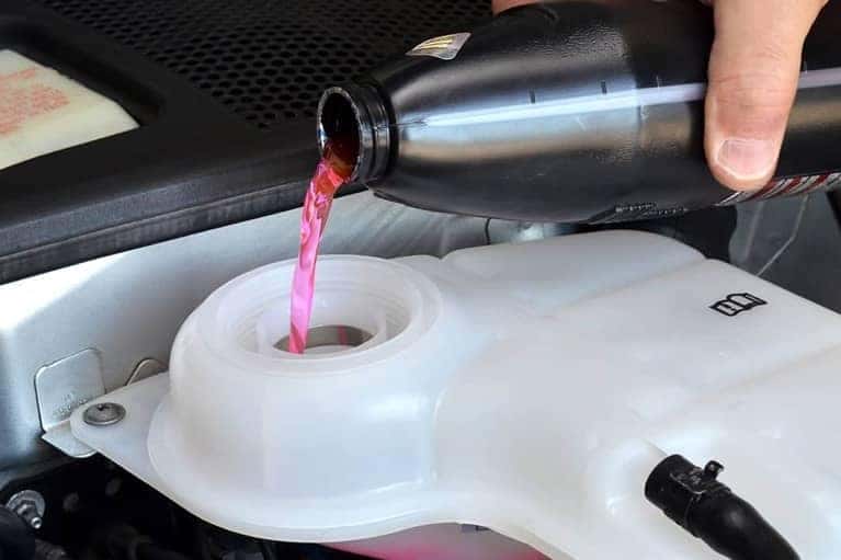 Mechanic Replacing Engine Coolant