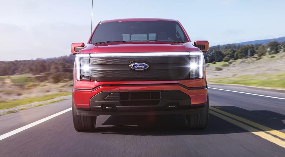 A red 2022 Ford F-150 is shown from the front.