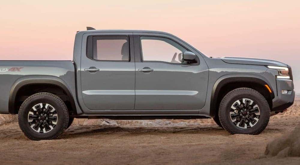 A gray 2021 Nissan Frontier Pro4x is shown from the side after leaving a Hartsville Nissan dealer.