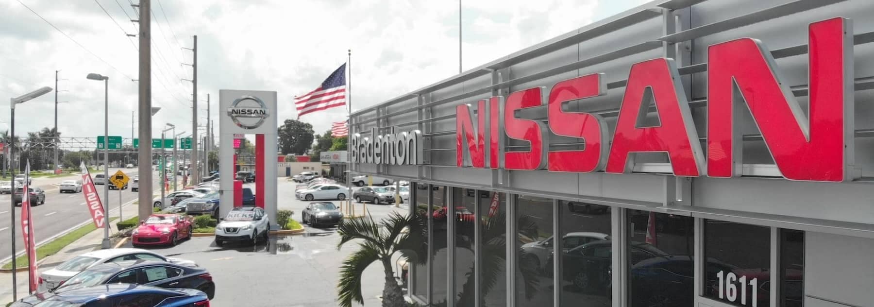 An exterior shot of the Nissan dealership
