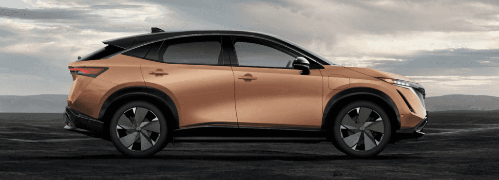 2023-nissan-ariya-parked-dark-dirt-desktop