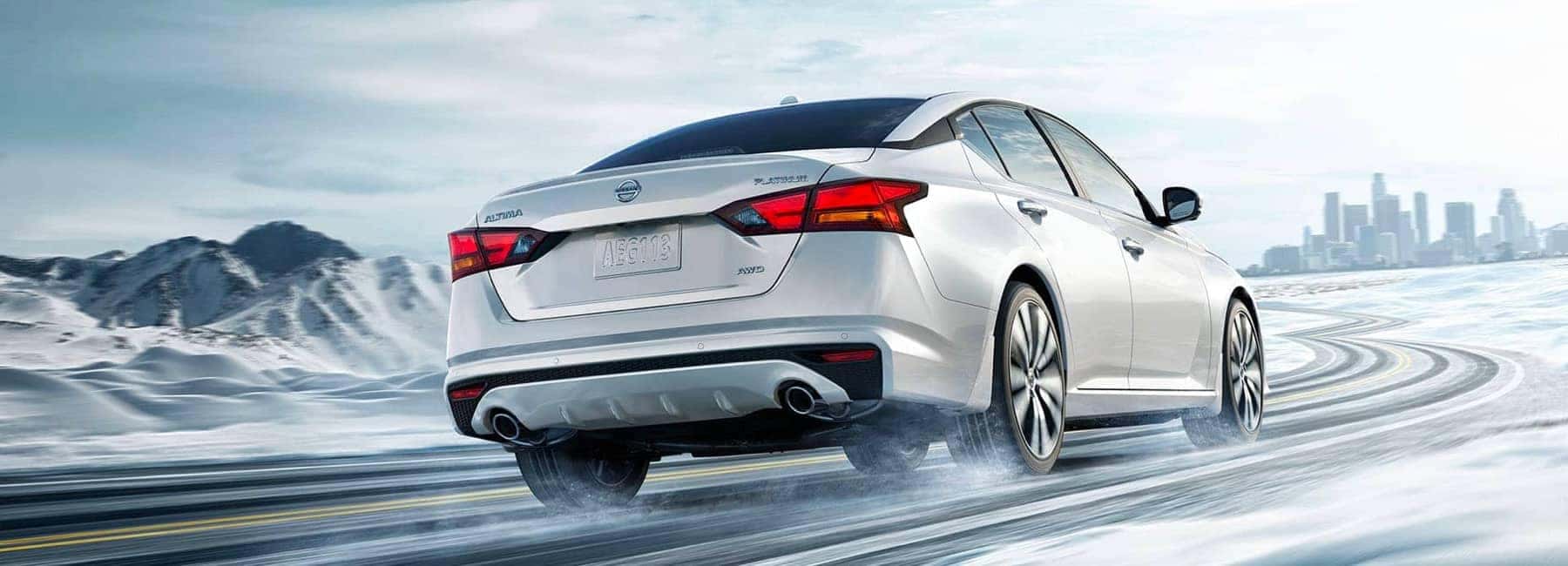 Nissan Altima driving in the snow