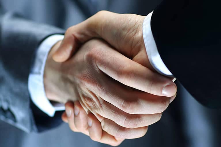 Businessmen-in-Suits-Shaking-Hands