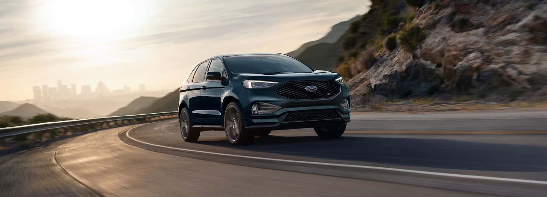 2024-Ford-Edge-speeds-up-winding-mountain-road