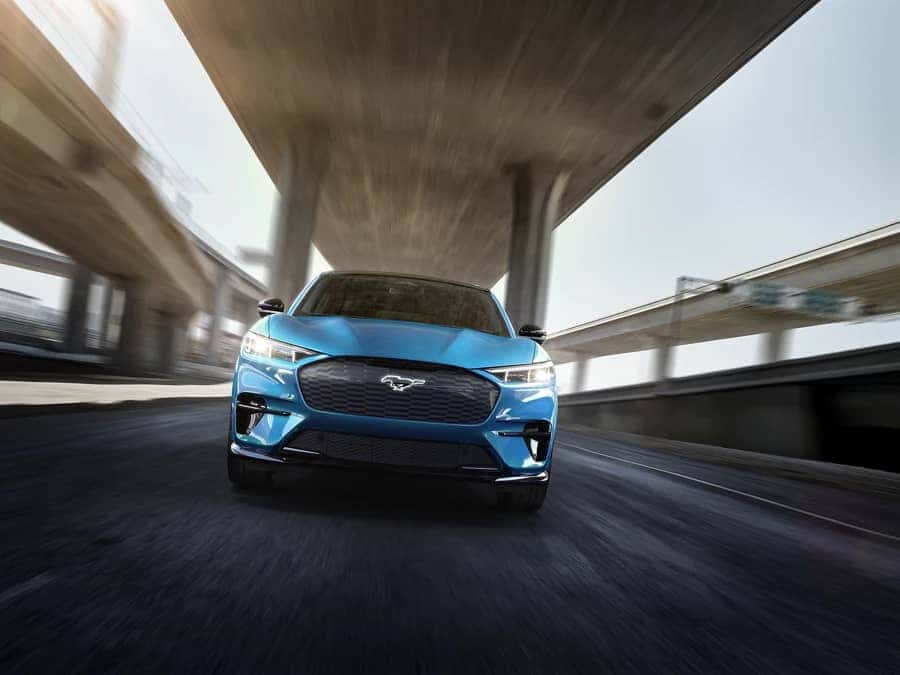 Ford-2022-Mustang-Mach-E-speeding-down-a-freeway