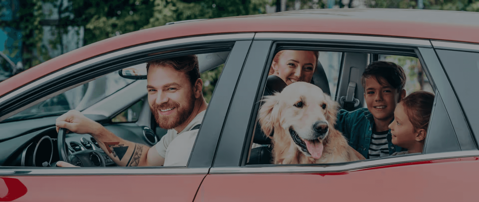 Family in car with dog