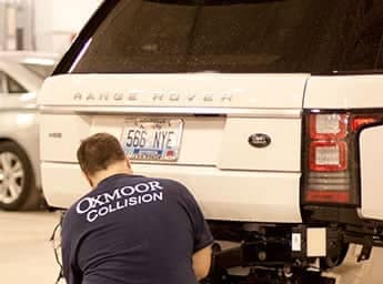 Technician servicing a Land Rover