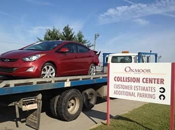 Red car being towed