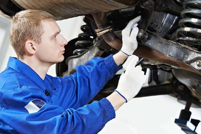 Mechanic servicing a vehicle