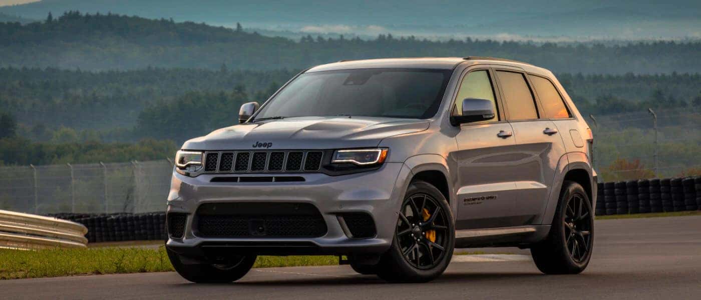 2020 Jeep Grand Cherokee in grey parked on race test track