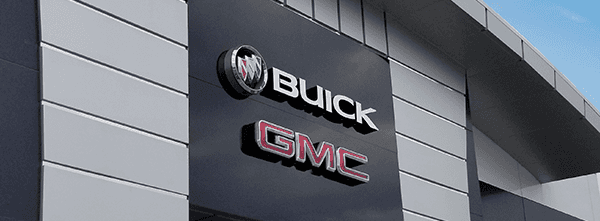 Buick and GMC badges on a building.