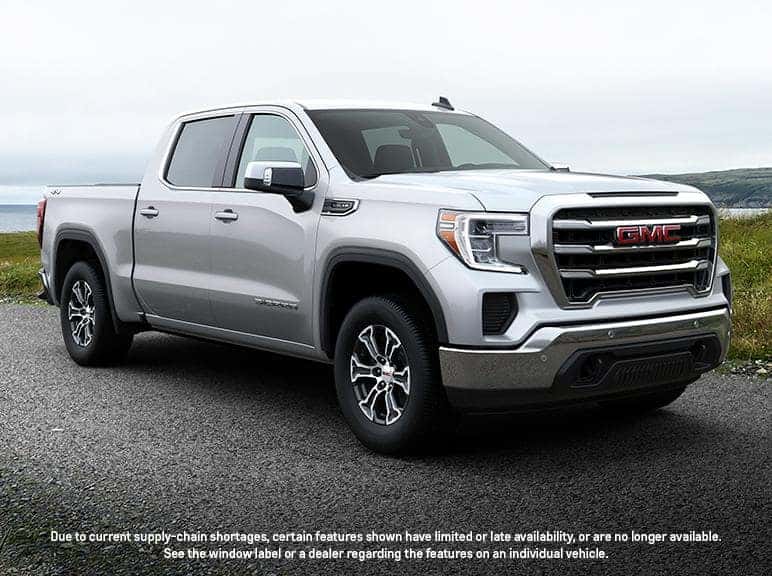A silver GMC Sierra 1500 parked.