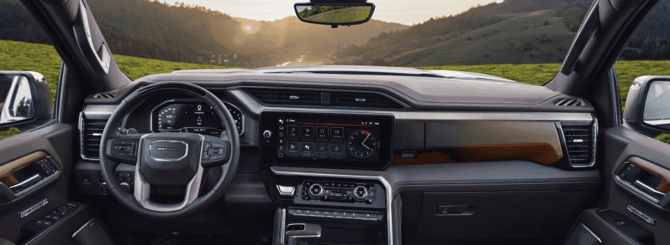 The black and brown interior in a 2024 GMC Sierra 1500.