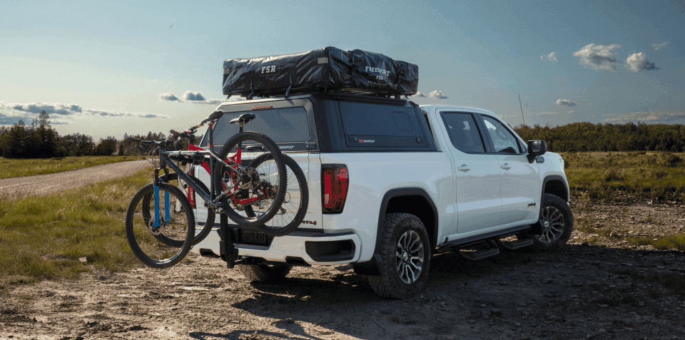 A white 2024 GMC Sierra 1500 parked off-road.