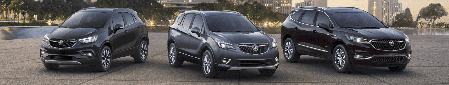 Three Buick SUVs parked.