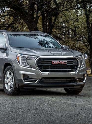 A silver GMC Terrain parked.