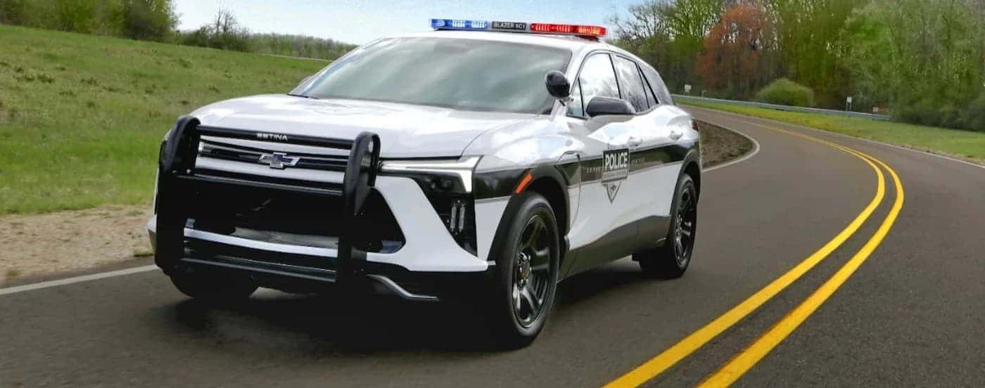 A 2025 Chevy Blazer EV driving on a highway.