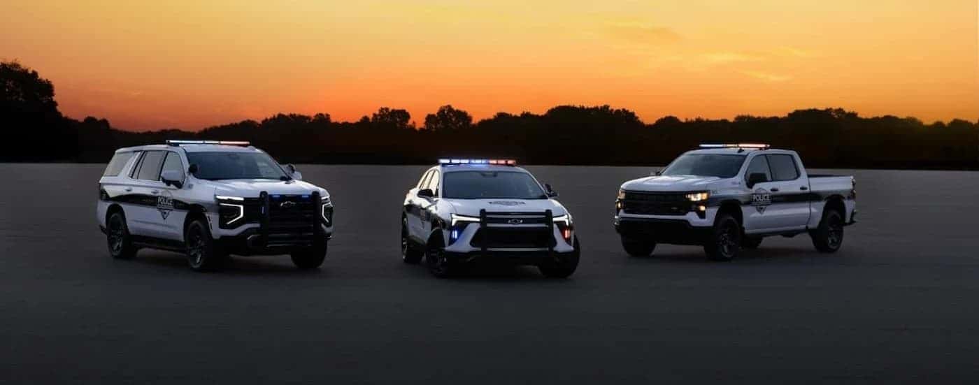A 2025 Chevy Tahoe, Blazer EV and Silverado are parked offroad.