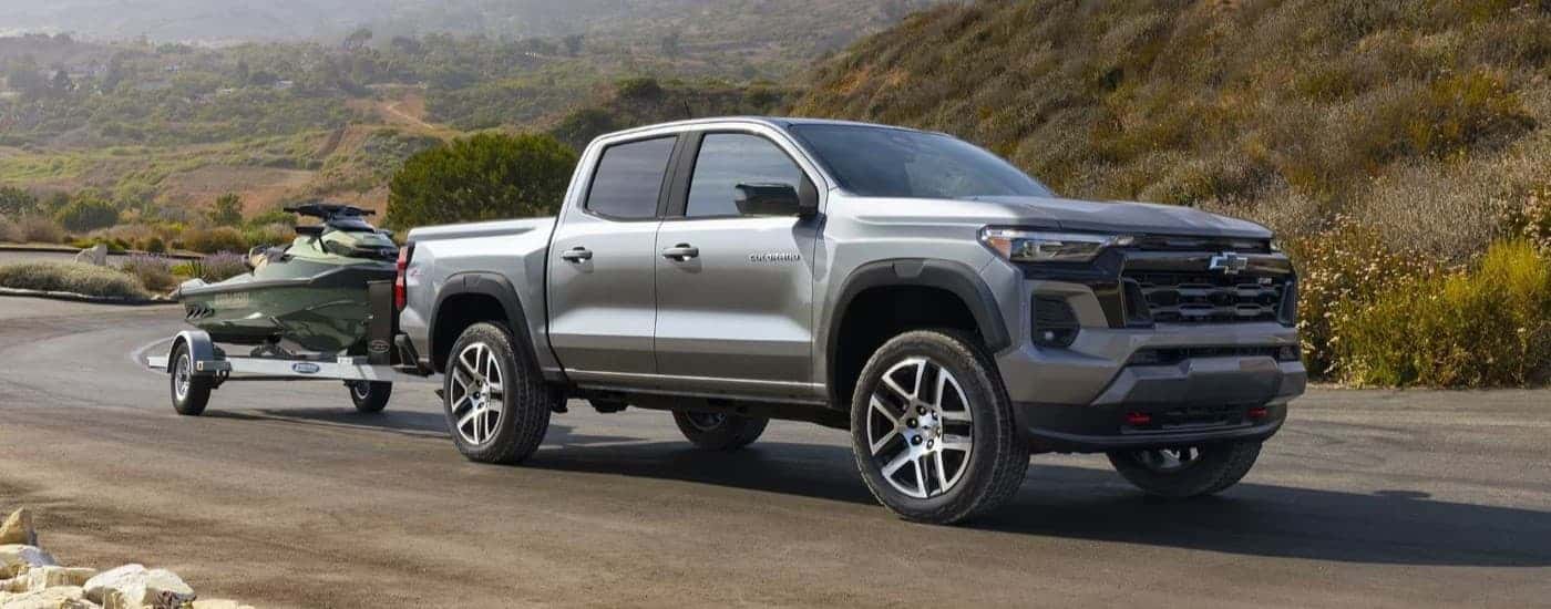 A grey 2024 Chevy Colorado Z71 towing a jetski.