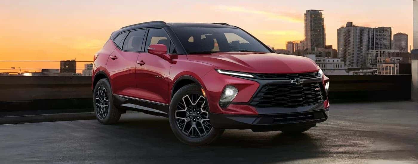 A red 2024 Chevy Blazer parked and angled right.